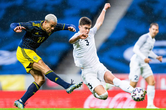 Robin Quaison of Sweden and Maksim Paskotsi of Estonia