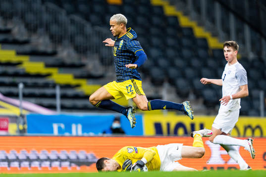 Robin Quaison of Sweden and goalkeeper Matvei Igonen of
