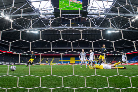 Marcus Berg of Sweden scores 1-0 behind goalkeeper Matvei