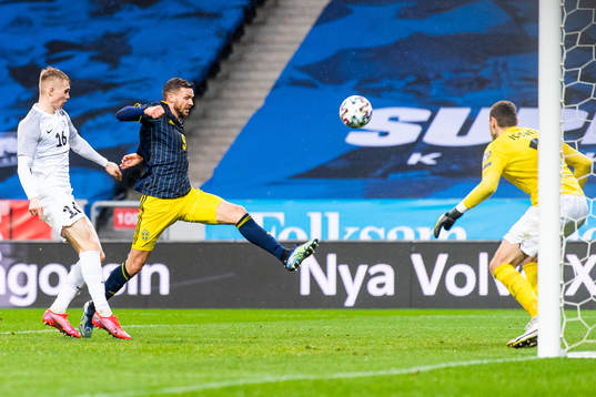 Henrik Pürg and goalkeeper Matvei Igonen of Estonia