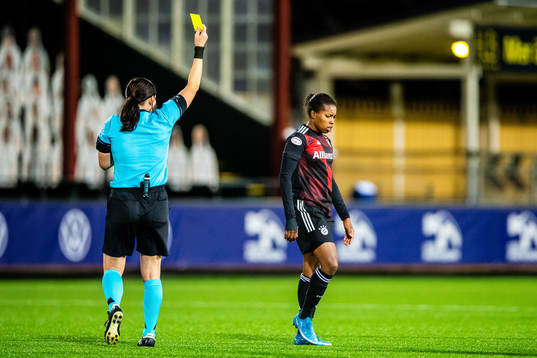 Lineth Beerensteyn of Bayern Munich gets a yellow card