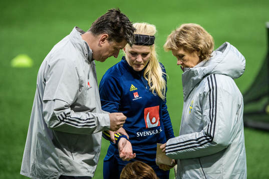 goalkeeper Emma Holmgren of Sweden receives medical