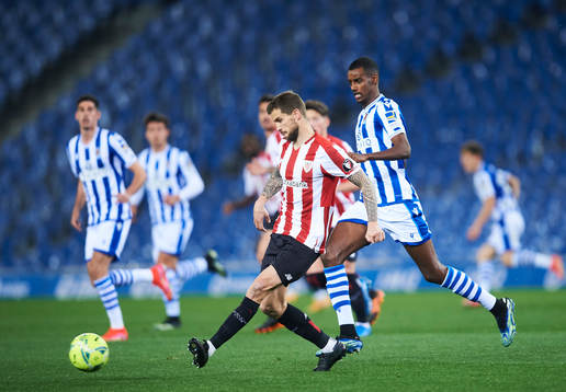 Alexander Isak of Real Sociedad duels for the ball with