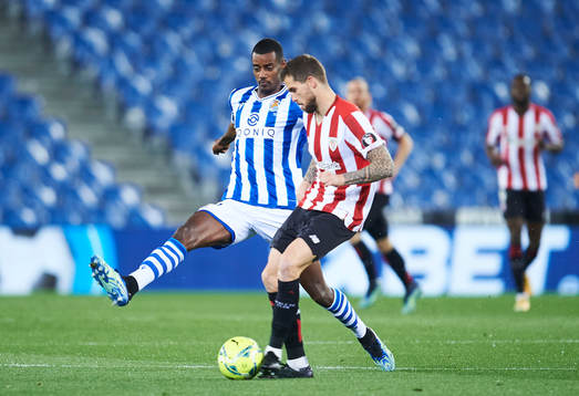Alexander Isak of Real Sociedad duels for the ball with