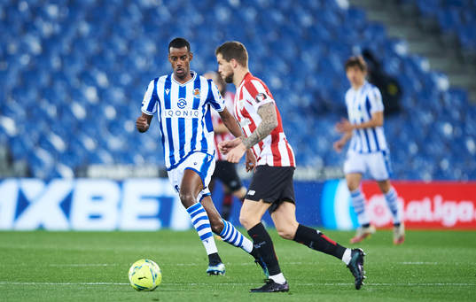 Alexander Isak of Real Sociedad duels for the ball with