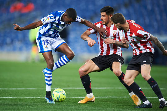 Alexander Isak of Real Sociedad duels for the ball with