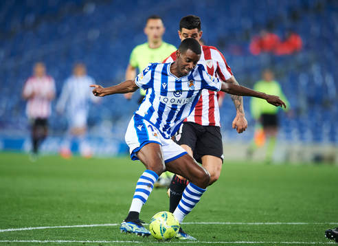 Alexander Isak of Real Sociedad duels for the ball with