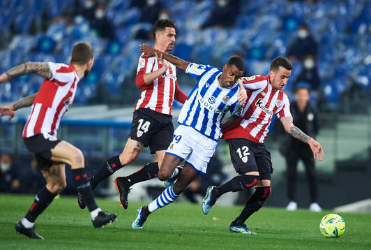 Alexander Isak of Real Sociedad duels for the ball with