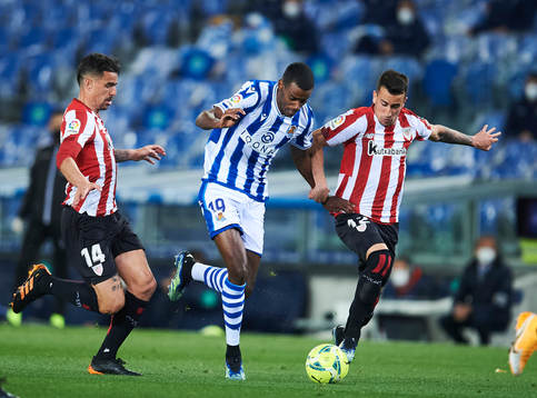 Alexander Isak of Real Sociedad duels for the ball with