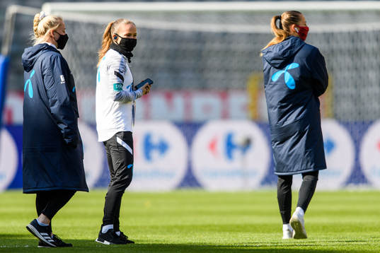 Guro Reiten of Norway walk the pitch