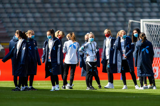 Players of Norway walk the pitch