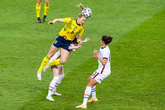 Magdalena Eriksson of Sweden compete for the ball with Rose