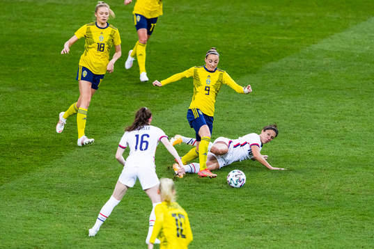 Kosovare Asllani of Sweden and Carli Lloyd of USA