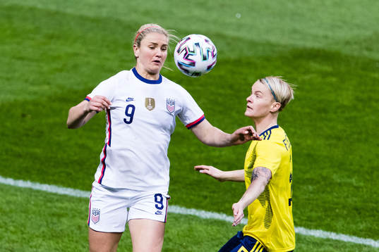Lindsey Horan of USA and Nilla Fischer of Sweden