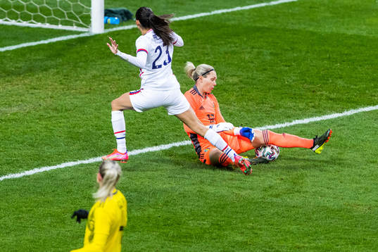Christen Press of USA and goalkeeper Jennifer Falk of Sweden