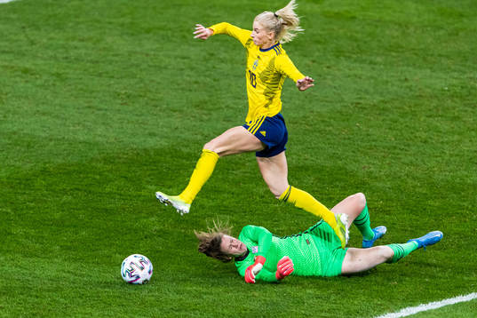 Sofia Jakobsson of Sweden jumps over goalkeeper Alyssa