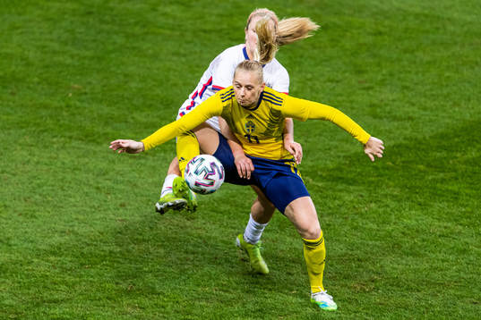of USA Lindsey Horan and Stina Blackstenius of Sweden