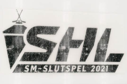 SHL och slutspelslogo på isen