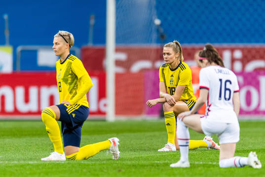 Fridolina Rolfö of Sweden takes a knee in support of the