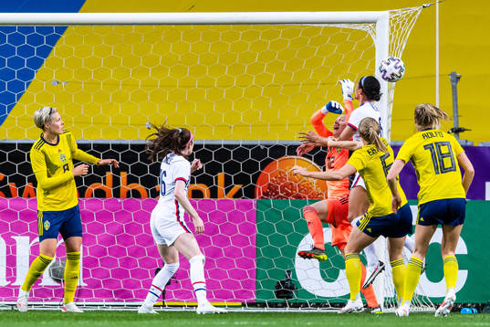 Goalkeeper Jennifer Falk of Sweden and Lynn Williams of USA