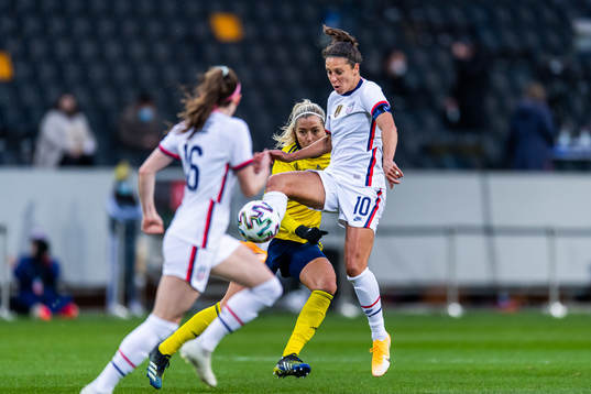 Linda Sembrant of Sweden and Carli Lloyd of USA compete for