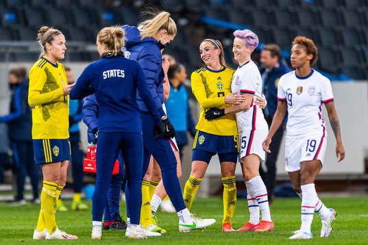 Kosovare Asllani of Sweden and Megan Rapinoe of USA