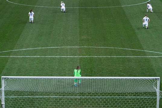 Goalkeeper Alyssa Naeher of USA takes a knee in support of