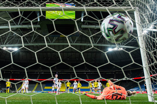 Megan Rapinoe of USA score the 1-1 goal behind goalkeeper