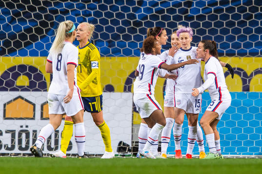 Megan Rapinoe of USA celebrates with team mates