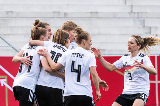 Laura Freigang of Germany celebrate with team mates