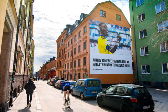 A hand painted billboard for Adidas of the Swedish football