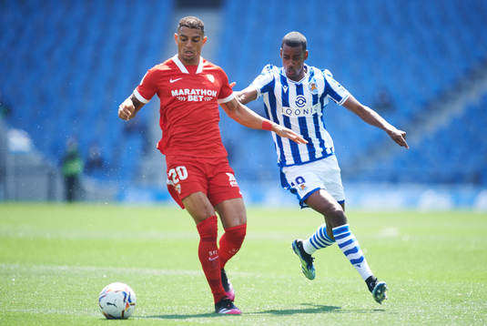 Alexander Isak of Real Sociedad duels for the ball with