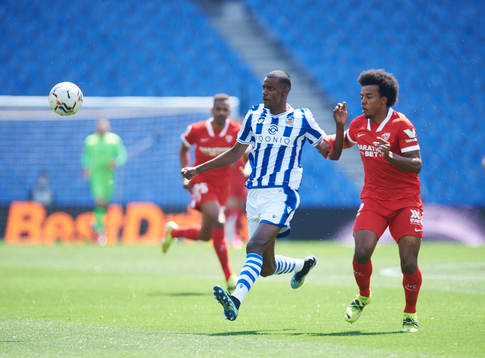 Alexander Isak of Real Sociedad duels for the ball with