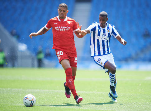 Alexander Isak of Real Sociedad duels for the ball with