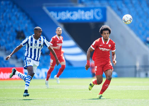 Alexander Isak of Real Sociedad duels for the ball with