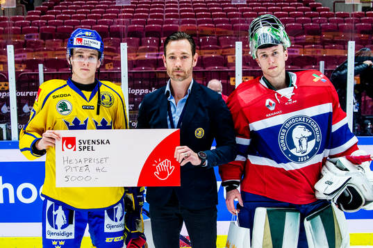 Nils Lundkvist of Sweden and goalkeeper Henrik Haukeland of