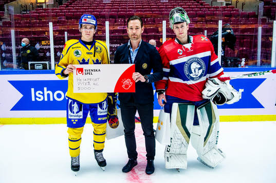 Nils Lundkvist of Sweden and goalkeeper Henrik Haukeland of