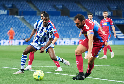Alexander Isak of Real Sociedad duels for the ball with