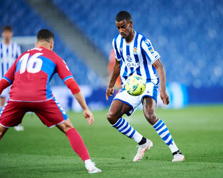 Alexander Isak of Real Sociedad duels for the ball with