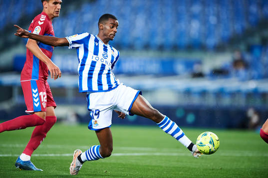 Alexander Isak of Real Sociedad duels for the ball with