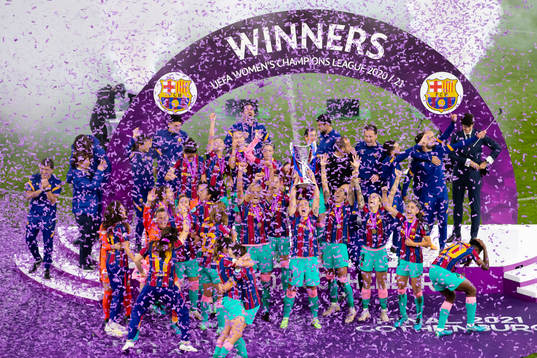 Barcelona celebrates with the trophy
