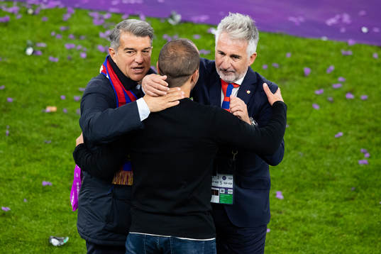 President Joan Laporta, coach Lluis Cortes and director