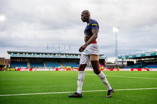 Moses Dramwi Mawa of Strømsgodset walks off the pitch with