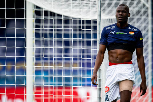 Moses Dramwi Mawa of Strømsgodset walks off the pitch with
