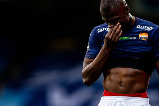 Moses Dramwi Mawa of Strømsgodset walks off the pitch with