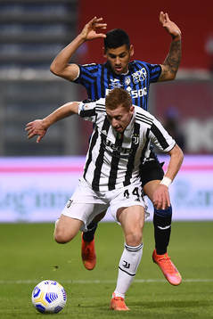 Dejan Kulusevski of Juventus and Cristian Romero of Atalanta