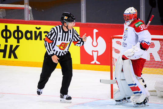 Referee Mikael Nord and goalkeeper Simon Hrubec of Czech