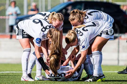 Cesilie Andreassen of Rosenborg (on the ground) celebrates