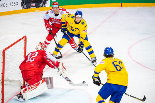 Isac Lundström and Rickard Rakell of Sweden and goalkeeper