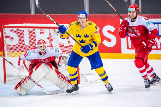 Carl Klingberg of Sweden and goalkeeper Sebastian Dahm and